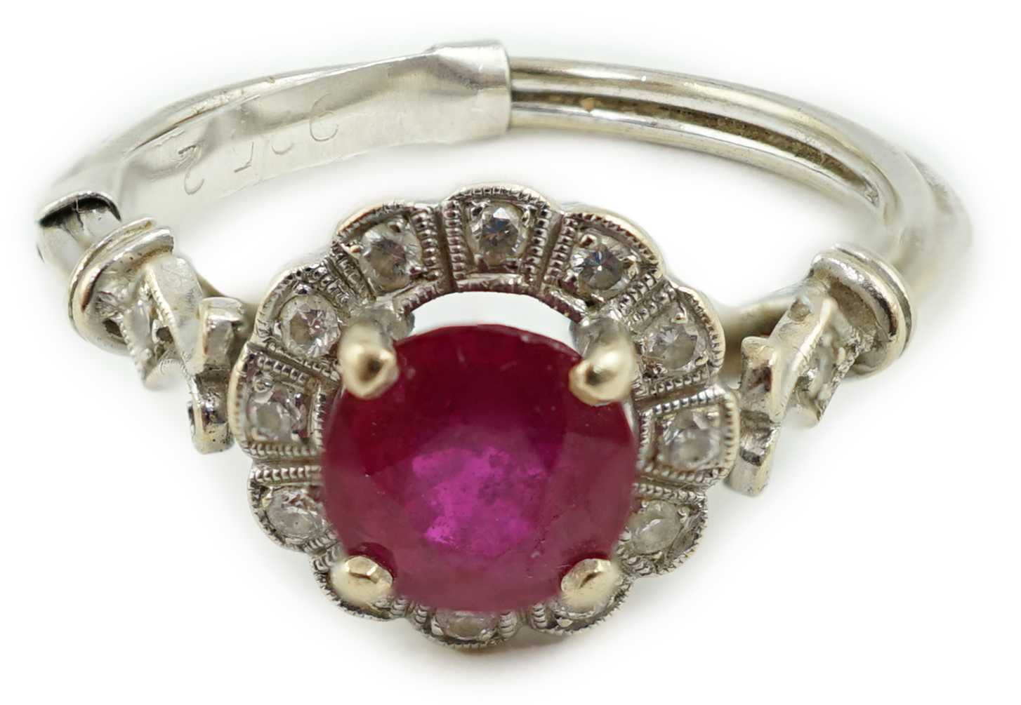 A recent 18ct white gold, ruby and diamond set cluster ring